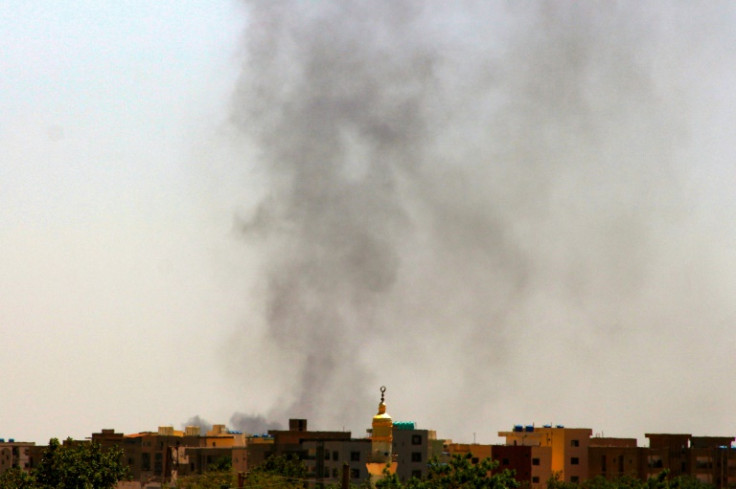 Smoke rises above buildings in war-ravaged Khartoum