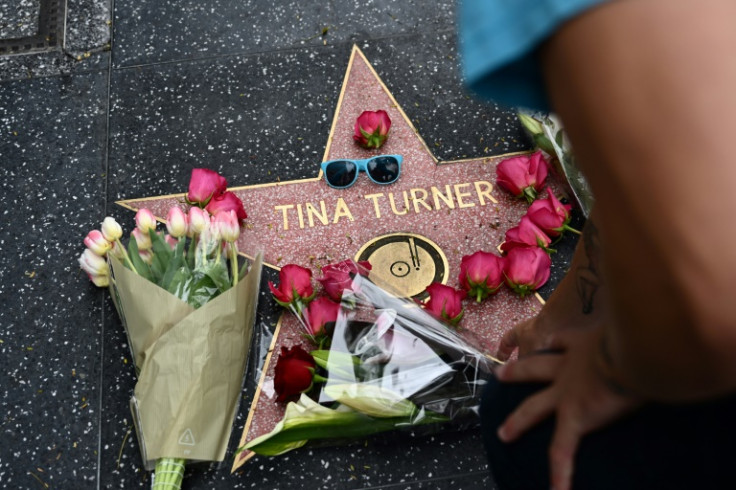 A fan places flowers on Tina Turner's star on the Hollywood Walk of Fame