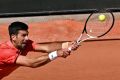 The Belgrade-born tennis superstar wrote the message in Serbian after his opening round victory over Aleksandar Kovacevic
