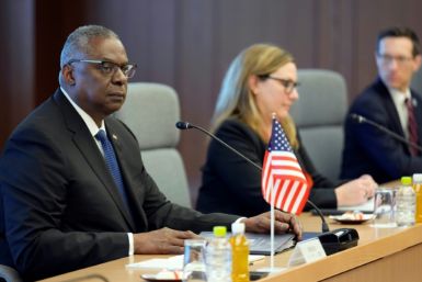US Secretary of Defense Lloyd Austin (L) delivers an opening address at his meeting with his Japanese counterpart Yasukazu Hamada