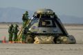Boeing and NASA teams work around Boeing’s CST-100 Starliner spacecraft after it landed at White Sands Missile Range’s Space Harbor, May 25, 2022
